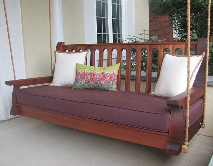 classic wooden front porch swing